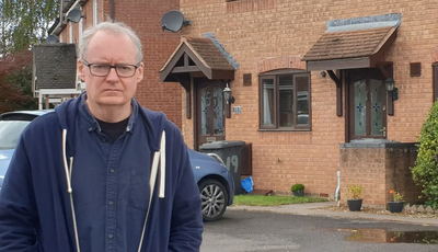 Declan Wilson outside affordable homes in Podsmead