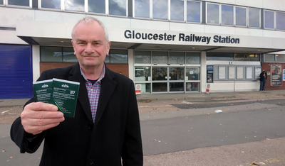 Jeremy Hilton at Gloucester Railway Station, with current timetable to London