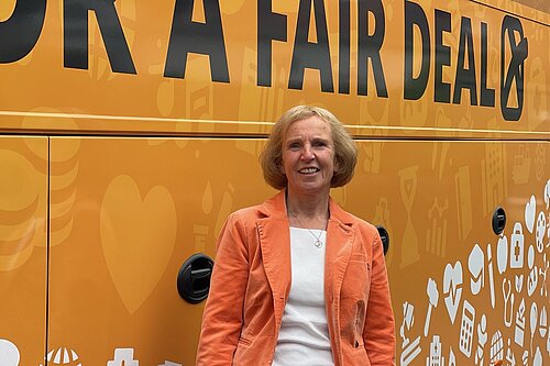 Susan in front of bus