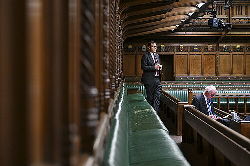 Tom Gordon stood speaking in the House of Commons Chamber