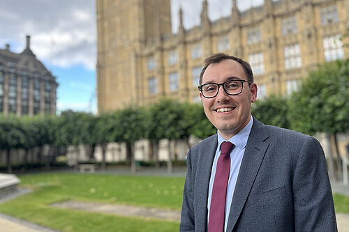 Tom Gordon MP stood outside the Houses of Parliament