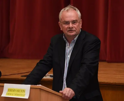 Jeremy Hilton speaking at a rostrum