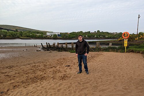 Grant Toghill standing on Erskine Beach