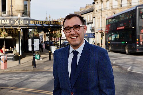 Tom Gordon MP stood in central Harrogate outside Bettys