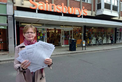 Rebecca Trimnell outside Sainsbury's with her petition