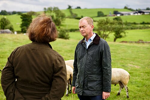 Tim listening to a local farmer