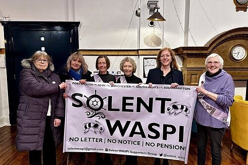 Liz standing with group of WASPI campaigners