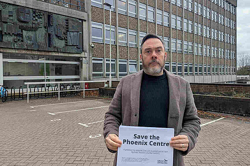 Kevin West outside County Hall holding the Save The Phoenix petition