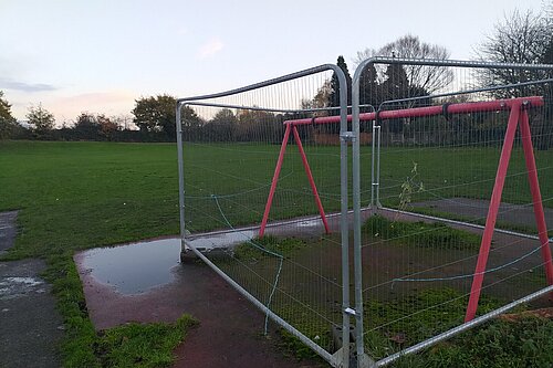 The park would be better served with something like a bench that can be used, rather than a cordoned swing set