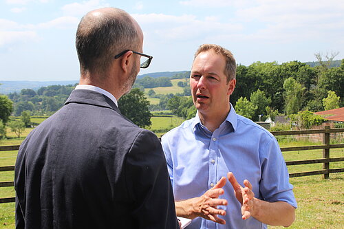 Richard Foord speaking to an interviewer in a field