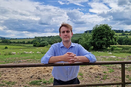 Cllr Glyn Preston on a farm.