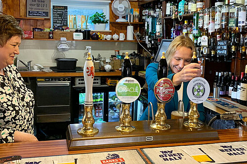 Helen Morgan pulling pints at a North Shropshire pub