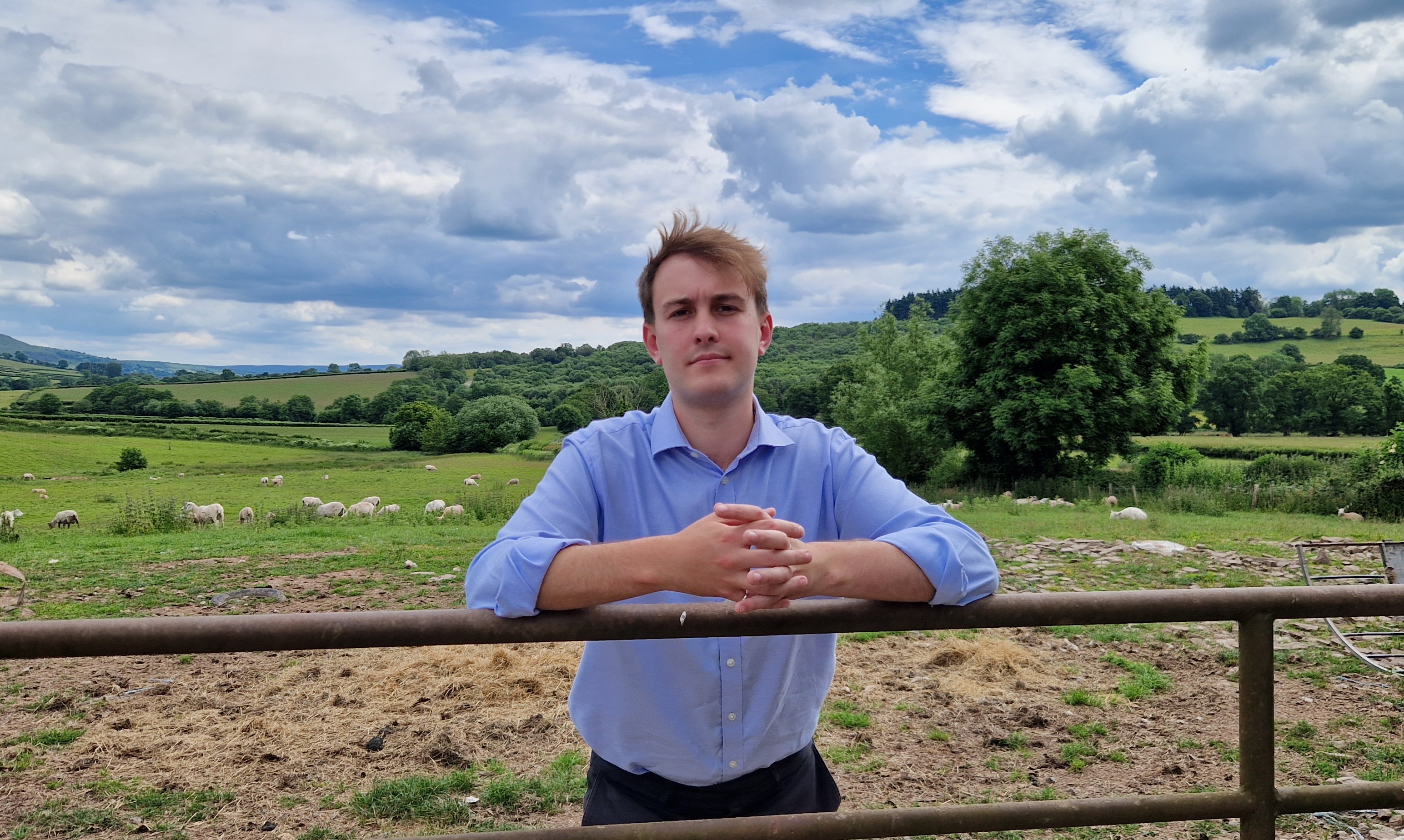 Cllr Glyn Preston on a farm.